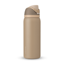 Full profile shot of the 32oz Down to Earth FreeSip water bottle in tan, highlighting its tan and silt colors.