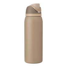 Full profile shot of the 40oz Down to Earth FreeSip water bottle in tan, highlighting its sleek design and sturdy construction.
