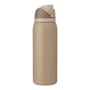 Full profile shot of the 40oz Down to Earth FreeSip water bottle in tan, highlighting its sleek design and sturdy construction.