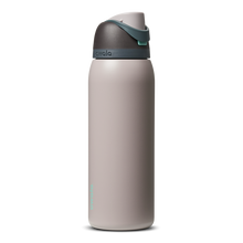 FreeSip 40oz in Neon Moon, light grey stone body with dark charcoal flip cap and teal accent detail
