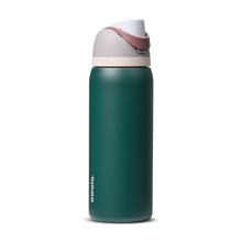 FreeSip 32oz in Serene Evergreen, deep forest green body with cream white flip cap and mauve-rose carry loop
